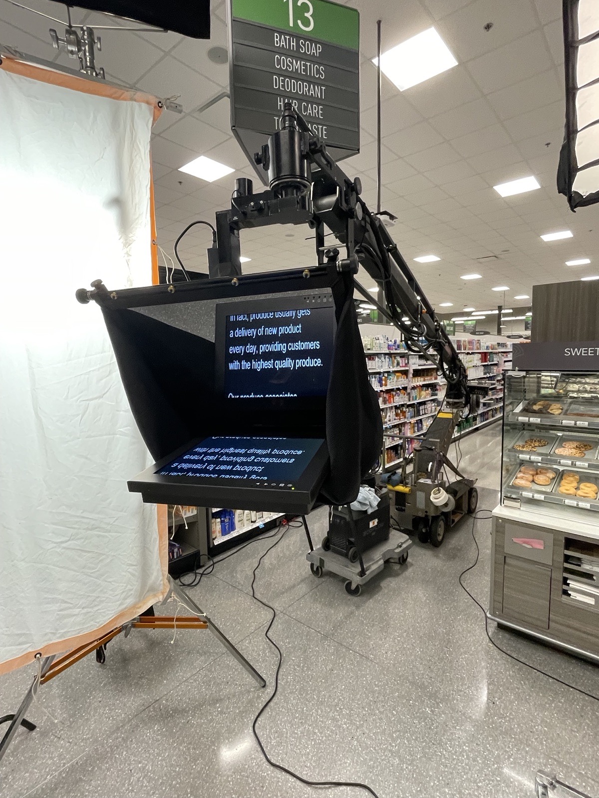 Camera crew with teleprompter on a commercial shoot in a store