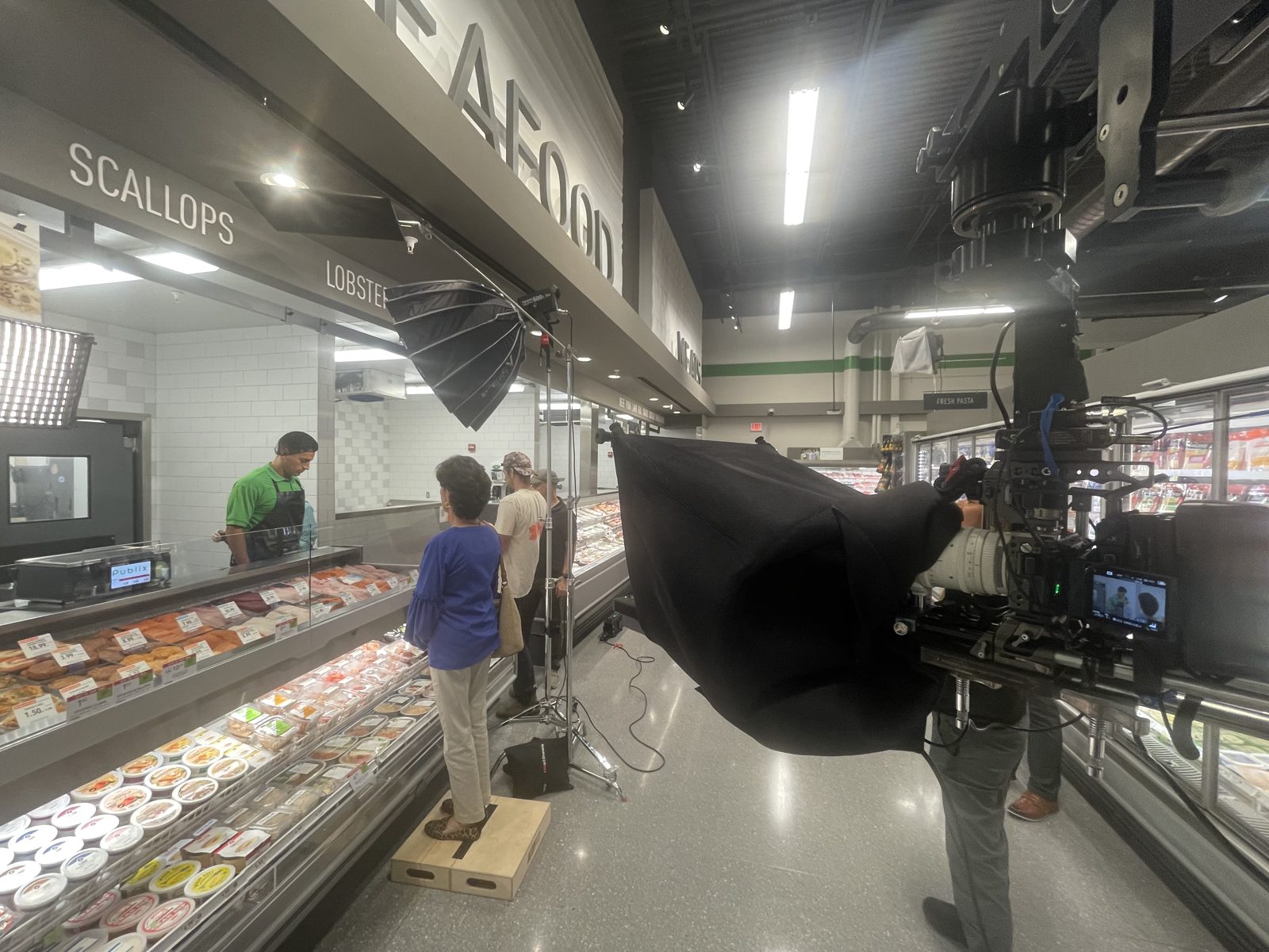 Camera-mounted teleprompter during a commercial production